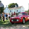 Rally participants are flagged off on a tour of the country roads around Bridgehampton.